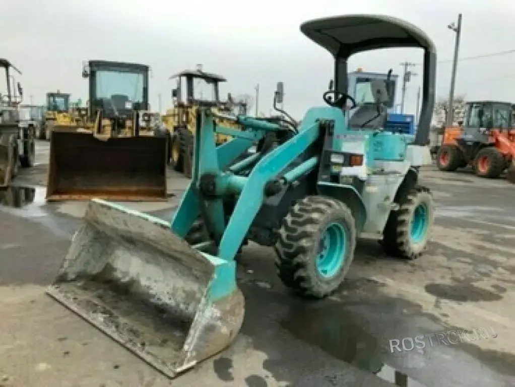 Аренда мини-погрузчика Kobelco с челюстным ковшом